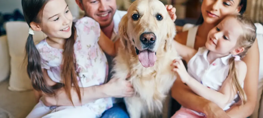 Family on Couch with Dog
